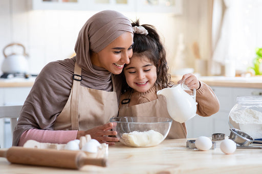 a mother and daughter making a cake in their kitchen that is free from Pantry Moths and Larvae